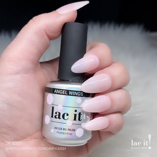 en Vogue Lac It! Angel Wings soft pink jelly UV/LED gel nail polish for professional nails and extensions on manicured nails holding polish bottle