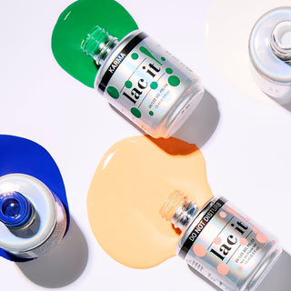 Collection of nail polish bottles with colorful caps on a white background